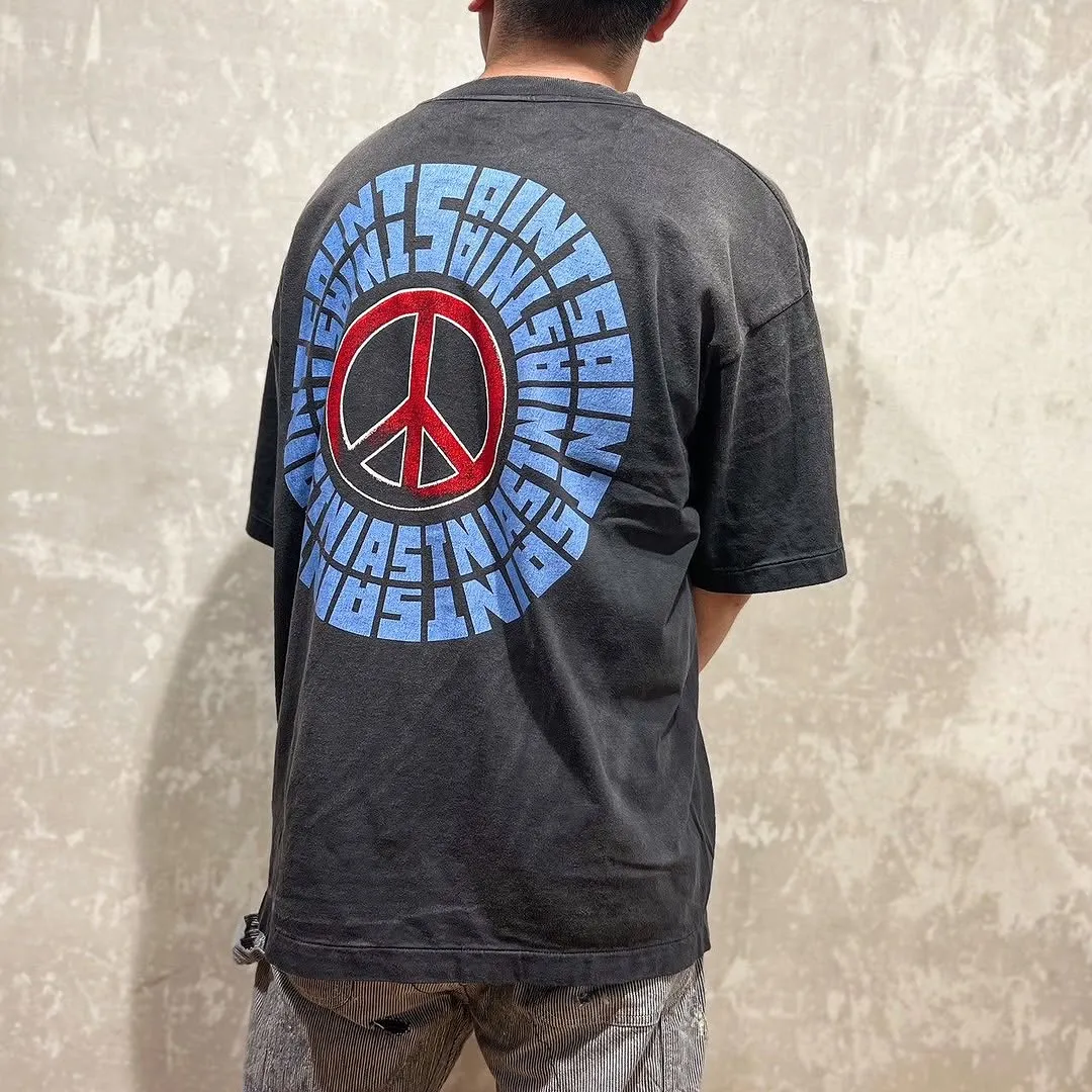 SAINT Mxxxxxx IDEOLOGICAL SS TEE/BLK Peace and anti-war crack pattern tee, washed black S-XL, look for the cylindrical fabric without side seams, the open width is almost meaningless Asut ready-made garments dyed, the whole piece is sprayed with horse-hair spray, and then sprayed again to fade, the collar and cuffs are frayed, many places are broken, oversized printing position, genuine level restoration, complete accessories, with little angel anti-counterfeiting label